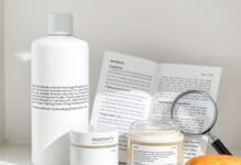 Fragrance-Free vs Unscented: What Labels Really Tell You Fragrance free skincare bottles beside an ingredient list and magnifying glass
