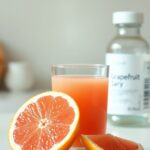 Grapefruit and Medicines: When the Interaction Matters Grapefruit and medications beside grapefruit juice and an unbranded medicine bottle